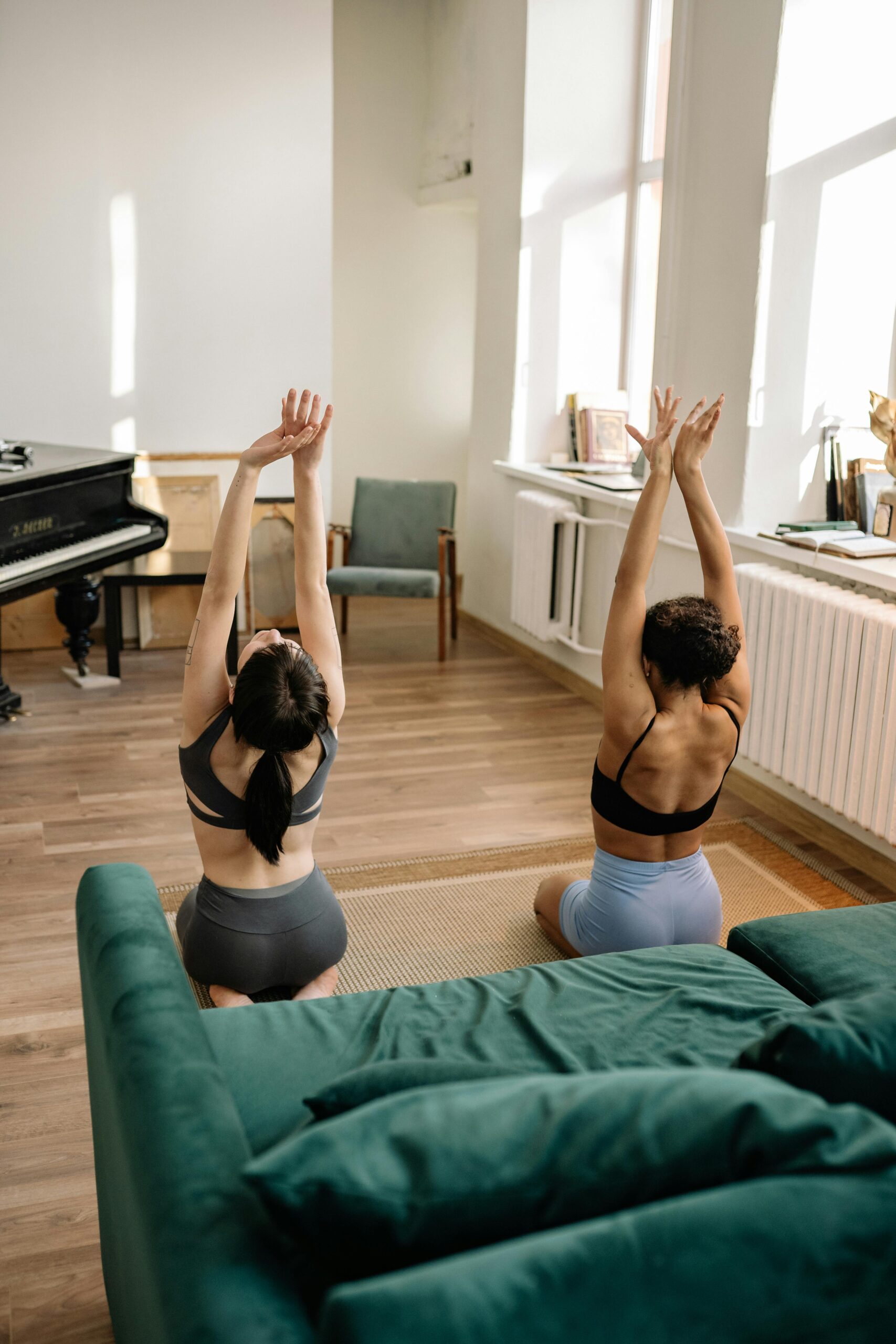 Woman in Black Sports Bra and Black Panty Doing Yoga on Blue Bed