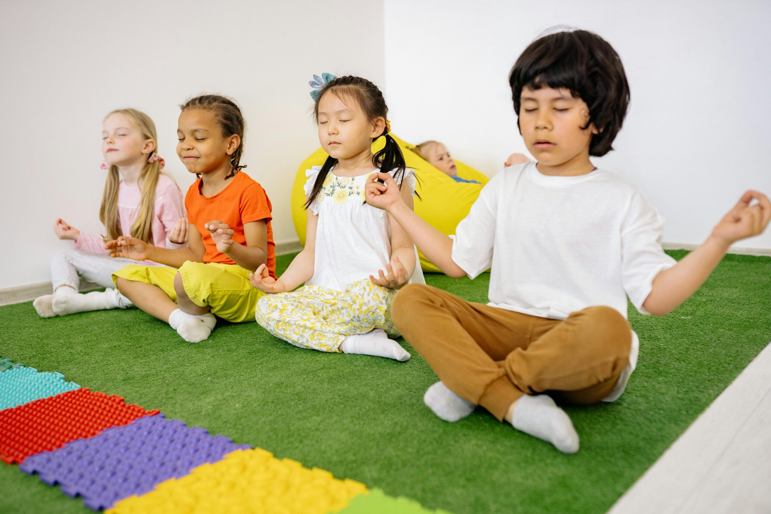 Children In Criss Cross Position With Closed Eyes